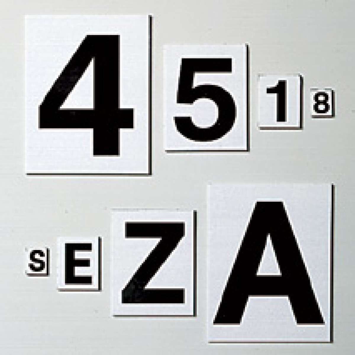 black and white magnetic numbers and letters