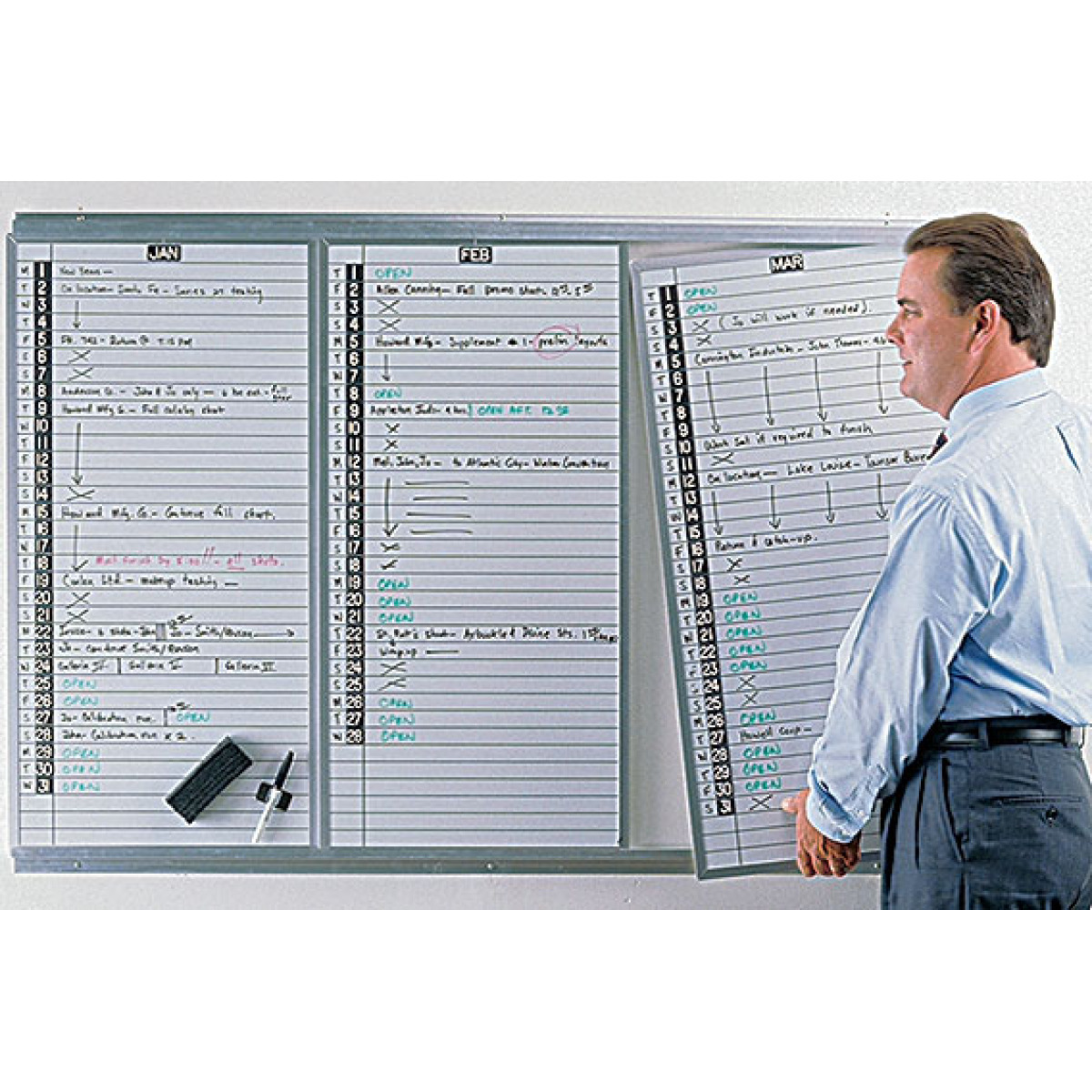 three lift-out whiteboard panels in mounting track
